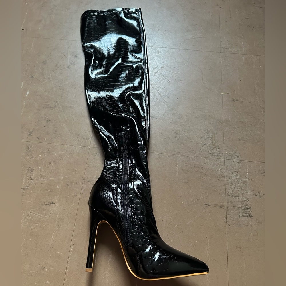 Black thigh high boot